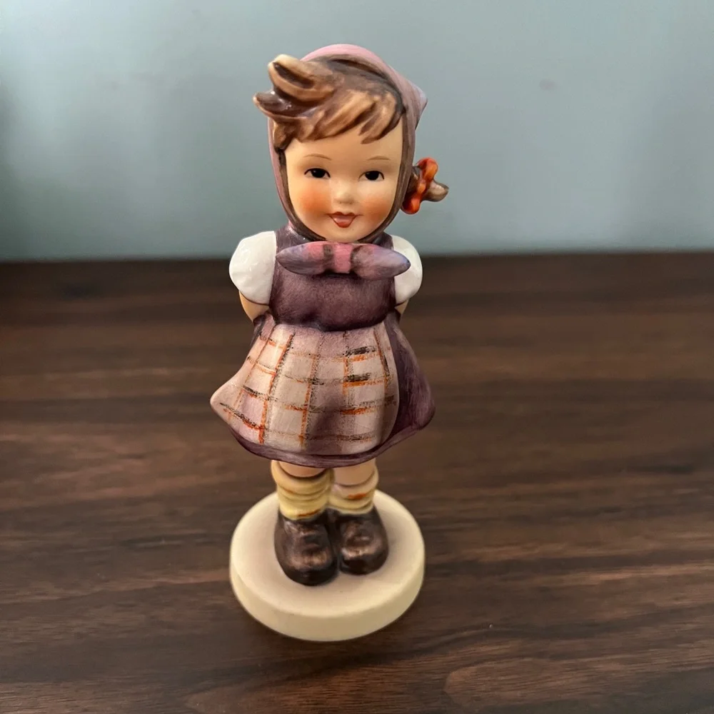 Charming Figurine with Purple and Brown Accents